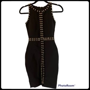 NWOT.  Sophisticated black dress with gold hardware